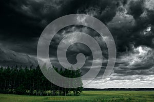 Dramatic thunder storm clouds at dark sky. Nature landscape