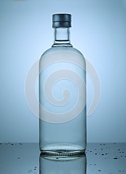 Dramatic transparent bottle with gradient light
