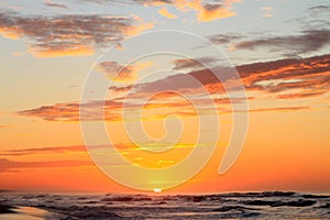 Dramatic Tropical Sunrise over Pacific Ocean and Sandy Beach