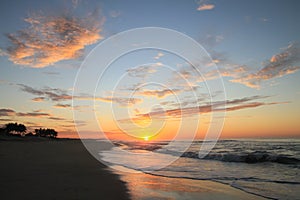 Dramatic Tropical Sunrise over Pacific Ocean and Sandy Beach