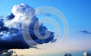 Dramatic unique storm cloud on beautiful blue sky