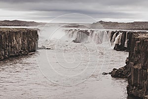 Dramatic view of Selfoss waterfall in cold and gray autumn weather