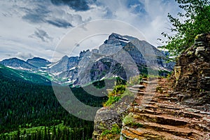 0000301_Dramatic view of a storm clouds around a bend of the Grinnell Glacier Trail, Glacier National Park - Montana with Mount