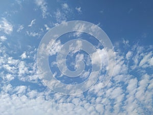 Dramatic White Clouds in a Blue Sky Background. Heavenly feeling white Cloud in a summer season at mid day