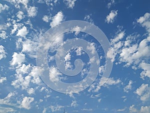 Dramatic White Clouds in a Blue Sky Background. Heavenly feeling white Cloud in a summer season at mid day