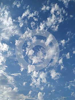Dramatic White Clouds in a Blue Sky Background. Heavenly feeling white Cloud in a summer season at mid day
