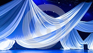 Dramatic white fabric draped stage setup