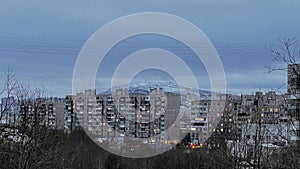 Dramatic winter city with city lights apocalyptic view