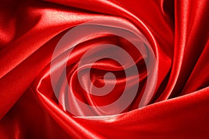 Drape a bright red satin fabric in the form of roses for the background