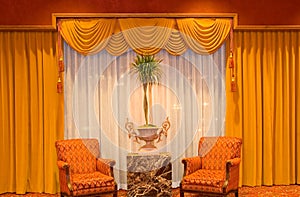 Draped curtains and chairs photo