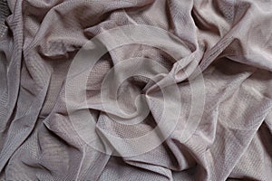 Draped dull dusky pink polyester mesh fabric