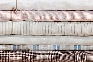 Drapery store, linen fabric in rolls, fabric shop for interior and clothing, natural tailoring fabrics