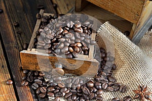 drawer of a coffee grinder filled with grain
