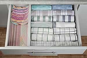 Drawer with folded towels. Order in kitchen