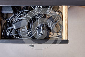 Drawer full of wired chargers