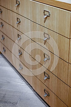 Drawers in modern furniture module. Chest Wooden Drawer. Drawers to search for book records in the library