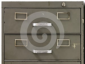 Drawers of an old metal filing cabinet