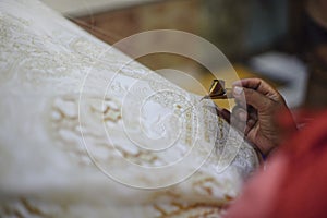 Drawing Batik Tulis on the fabric