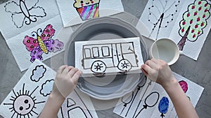 Drawing a bus, drawn on a napkin, for a children`s craft magic experience.