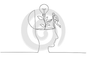 Drawing of businesswoman watering seedling plant with lightbulb idea flower concept of new idea. Single line art style