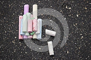 Drawing with chalks asphalt colored crayons