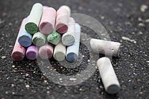 Drawing with chalks asphalt colored crayons