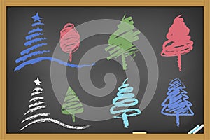 Drawing christmas tree on blackboard