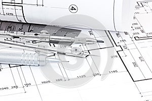 Drawing compass, ruler, pen and graphical architectural plans