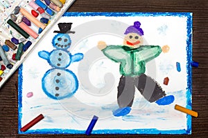 Drawing; Happy boy making a snowman. Winter recreations.