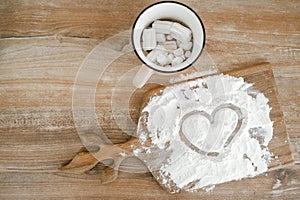 Drawing of a heart in flour