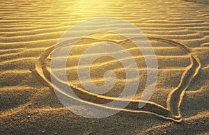 Drawing a heart on the sea beach