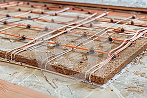 drawing layout lines for underfloor heating on subfloor