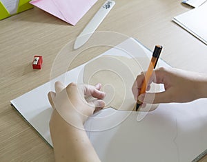 Drawing in paper with a template