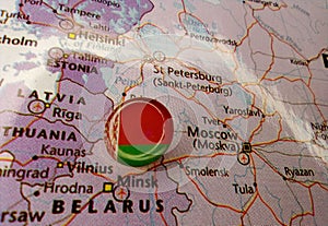 Drawing pin flag of Belarus on the map