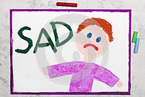 Drawing: Sad boy and word SAD