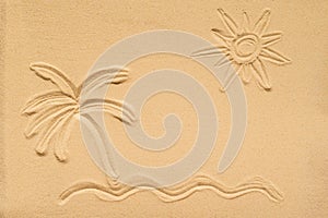 Drawing on sand illustrates a relaxing tropical beach scene with sea, a palm tree and sun. Travel, summer concept. Creative.