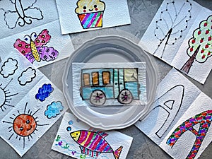 Drawing show, children`s magic experience in a plate of water, color appears