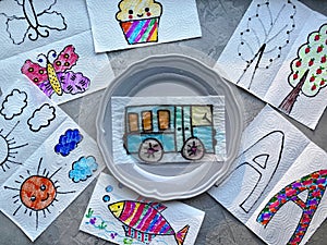 Drawing show, children`s magic experience in a plate of water, color appears. Children`s crafts