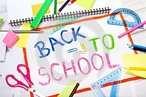 Drawing with words `back to school` and school accessories