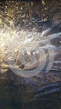 Silver patterns on the window glass