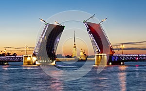 Drawn Palace Bridge and Peter and Paul Fortress at summer night, St. Petersburg, Russia