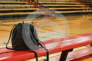 drawstring bag on a gym bleacher, basketball court insight