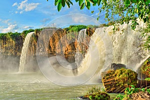 Dray Nour waterfall, against the blue sky, among the green equatorial vegetation, Daklak province, Vietnam