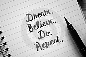 DREAM. BELIEVE. DO. REPEAT. hand-lettered in notebook