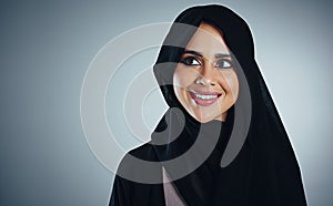Dream big, achieve big. Studio shot of a young muslim businesswoman against a grey background.
