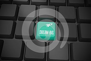 Dream big on black keyboard with green key