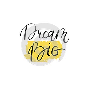 Dream big lettering on yellow brush stroke. Vector inspiration and motivation phrase.