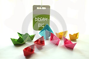 Dream Big. Monday spirit with paper boats and text messages.