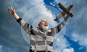 dream big. senior retired man. mature man at retirement. old man on sky background with toy plane