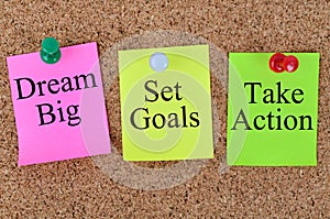 Dream big Set goals Take action written on notes